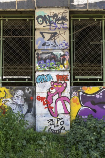 Graffiti with the pink panther on a wall-covered urban scene, Am Donaukanal Innere Stadt Vienna Austria