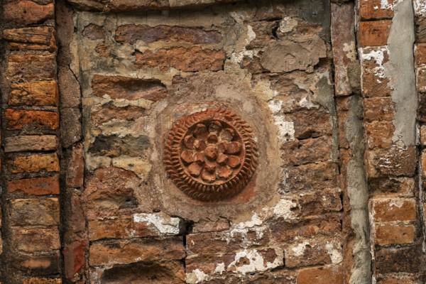 Detailed floral pattern in ancient brickwork in a rustic architectural setting-Dhaka, Bangladesh