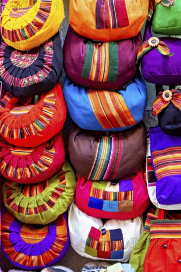 Close-up of colourful handmade bags with traditional patterns and vibrant colours, souvenir shops in La Paz Bolivia
