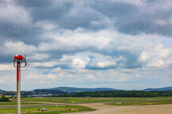Swiss Airlines Passenger Airplane Take Off From the Runway and Flying Against Blue Sky and Clouds in a Sunny Summer Day From the Airport in Kloten, Zurich, Zurich Canton, Switzerland