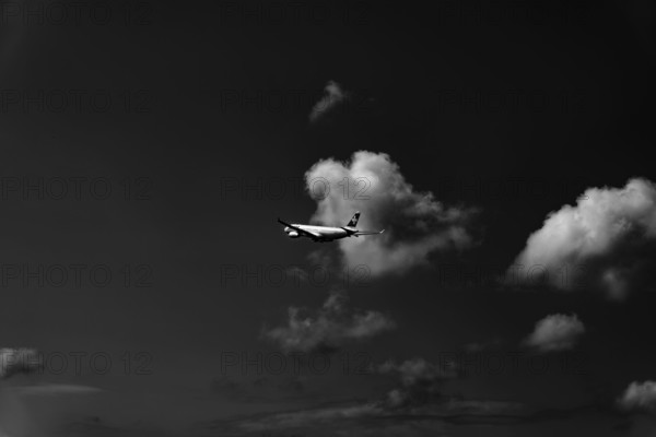 Swiss Airlines Passenger Airplane Flying Against Sky and Clouds in a Sunny Summer Day From the Airport in Kloten, Zurich, Zurich Canton, Switzerland