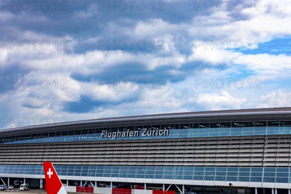 Zurich Airport and Building on Airfield in a Sunny Summer Day with Blue Sky and Clouds From the Airport in Kloten, Zurich, Zurich Canton, Switzerland