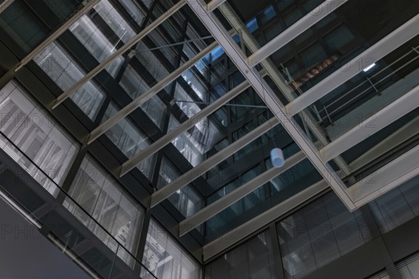 Modern Illuminated Office Building to Zurich Airport at Night in the Airport in Kloten, Zurich, Zurich Canton, Switzerland