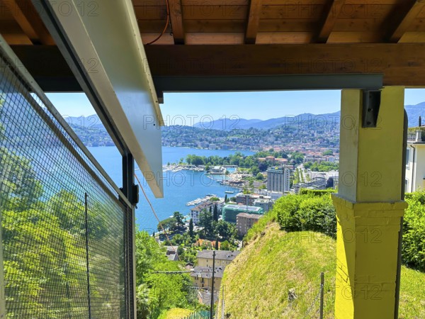 Panoramic View From Funicular Railway over Lake Lugano and Mountain View and Cityscape in a Sunny Summer Day in Lugano, Ticino, Switzerland