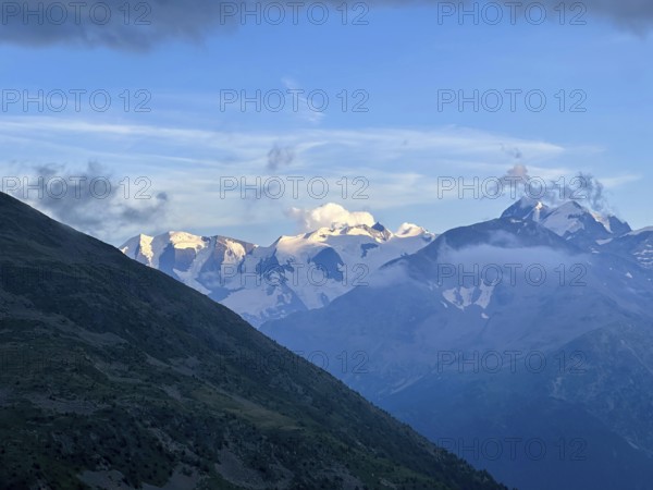 Beautiful Aerial View over the Swiss Alps with Glacier in a Sunny Summer Day and Sky with Clouds over St Moritz, Maloja, Grisons, Switzerland