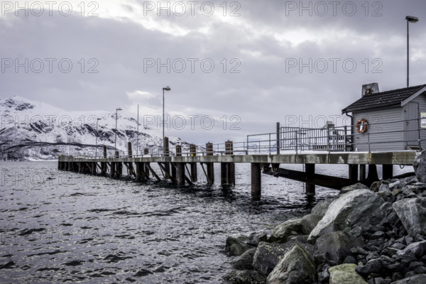 Norway tromsö snow mountains sea house jetty