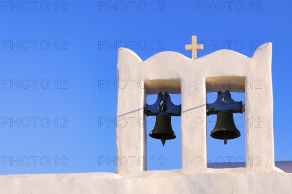 Sunrise serenity over Sifnos Iconic bells tower, Sifnos, Cyclades Islands, Greece