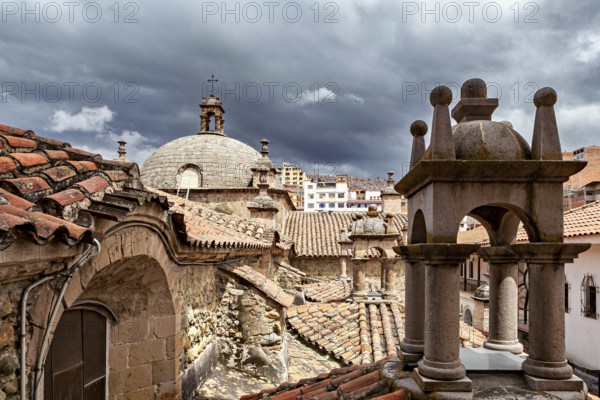 Historic roofs of a church with a dramatic sky in the background, San Fransisco Cathedral in La Paz Bolivia