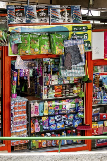Variety of household products in a well-stocked, colourful supermarket, small shops and restaurants in the market halls of La Paz in Bolivia