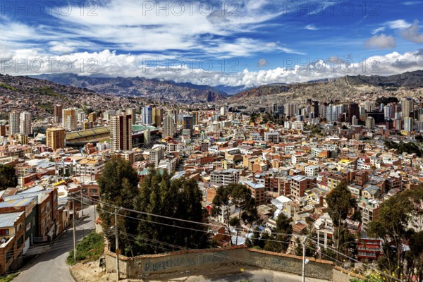 Panoramic view of a city with hills and many clouds in the sky, The houses and skyscrapers of the city centre of La Paz in Bolivia