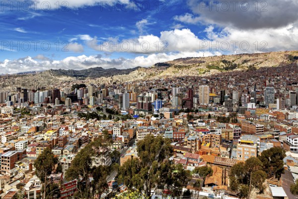 Cityscape with skyscrapers and cloudy sky in a mountain environment, The houses and skyscrapers of the city centre of La Paz in Bolivia
