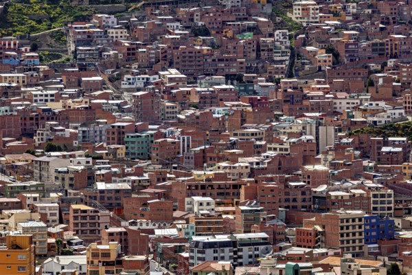 Dense cluster of houses on hills in an urban environment, The houses and skyscrapers of the city centre of La Paz in Bolivia