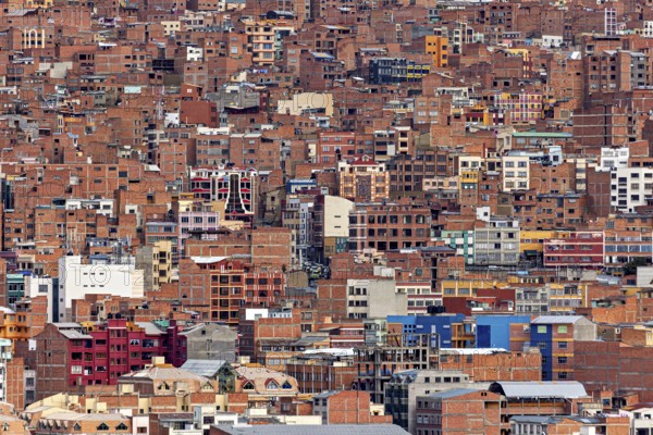 Dense collection of brick houses in an urban environment, The houses and skyscrapers of the city centre of La Paz in Bolivia