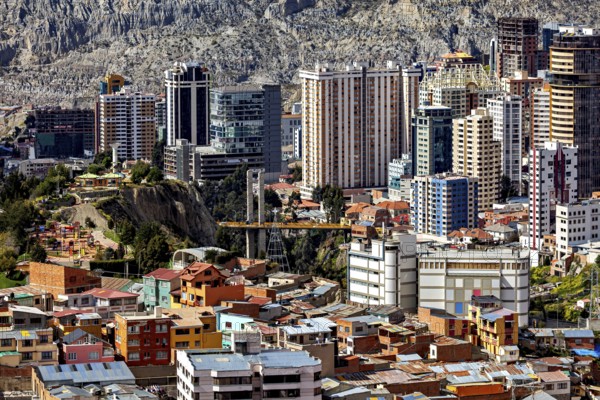 Urban landscape of La Paz with modern skyscrapers and bridge between hills, The houses and skyscrapers of the city centre of La Paz in Bolivia