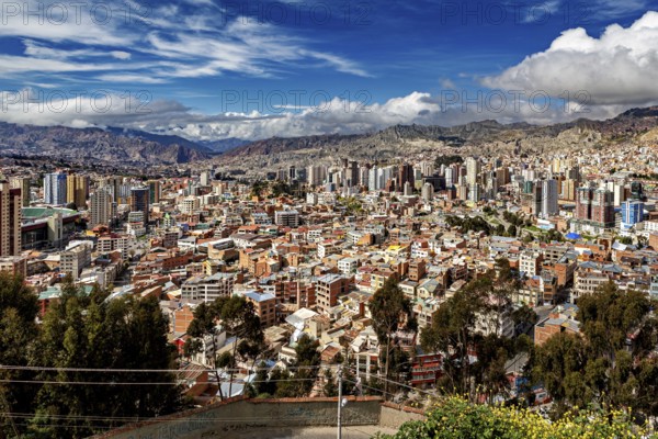 Panorama of La Paz with skyscrapers and hilly landscape under a blue sky, The houses and skyscrapers of the city centre of La Paz in Bolivia