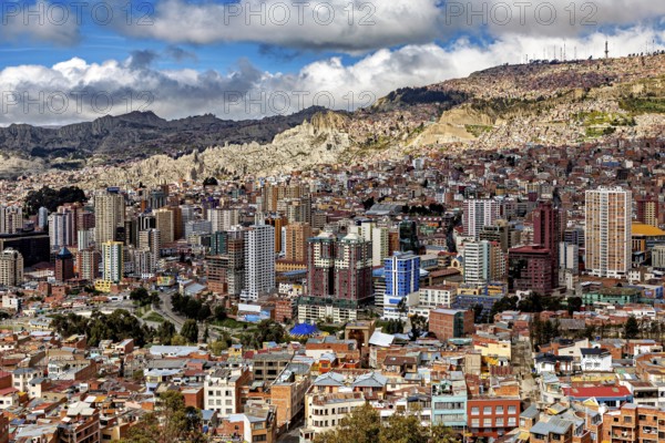 Sweeping panoramic view of the city, surrounded by mountains, The houses and skyscrapers of the city centre of La Paz in Bolivia