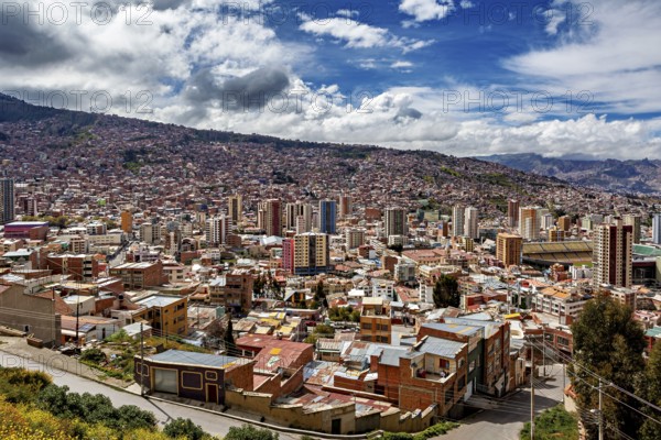 Sweeping city view with hilly landscape and clouds, The houses and skyscrapers of the city centre of La Paz in Bolivia