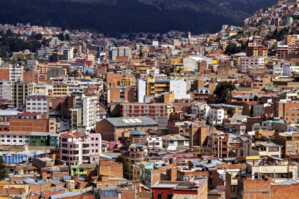 Dense urban development in front of a mountain landscape, The houses and skyscrapers of the city centre of La Paz in Bolivia