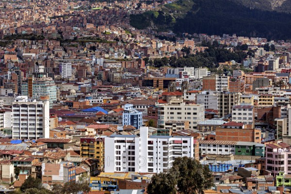 Urban panorama with surrounding mountains and numerous buildings, The houses and skyscrapers of the city centre of La Paz in Bolivia