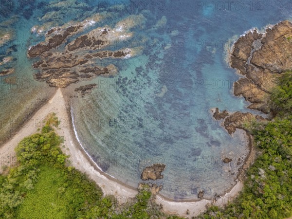 Aerial view, colourful rocks in the sea, rocky bay, Corsica, France