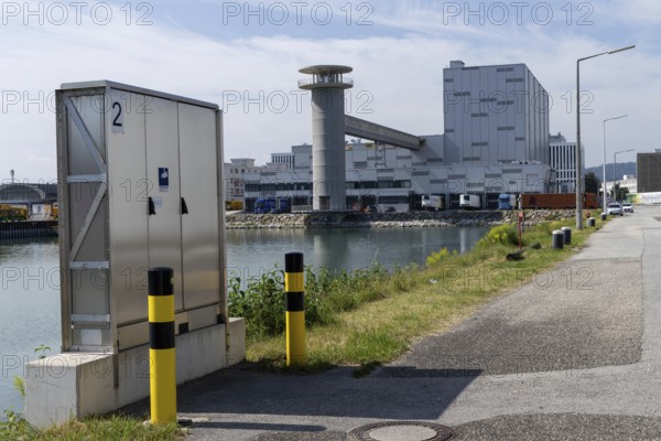 Industrial scenery with buildings next to a street under a blue sky, at the harbour Linz Upper Austria Austria