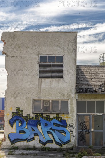 Graffiti with the word Bars on a dilapidated, urban building, at the harbour Linz Upper Austria Austria