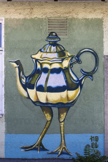 Surreal depiction of a teapot with legs, as a coloured mural, at the port of Linz Upper Austria Austria