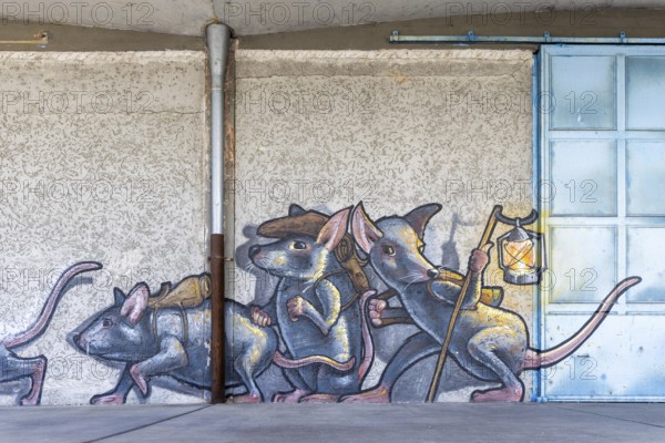 Imaginative depiction of mice with a lantern as wall graffiti, at Linz harbour Upper Austria Austria