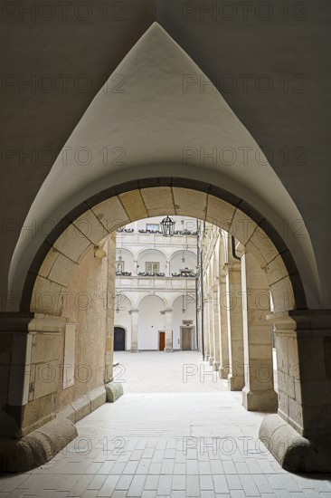 Arched passageway to an inner courtyard in a historic stone building, Arkardenhof Landhaus Linz Upper Austria Austria
