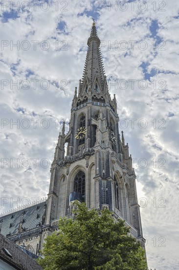 Gothic church tower rises high into the sky with detailed architecture, Linz Upper Austria Austria