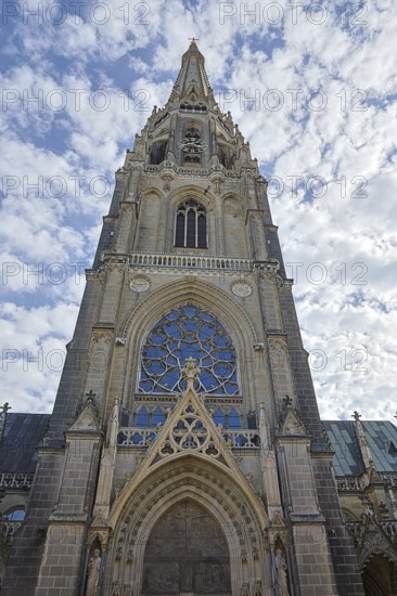 Gothic church façade with detailed stained glass windows and cloudy sky, Maria Empfängnis Dom Linz Upper Austria Austria