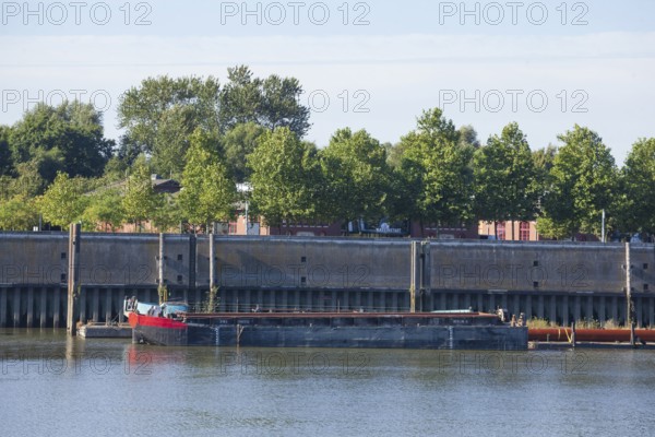 Shore with barge in Müggenburg customs harbour, Veddel, Hamburg, Germany