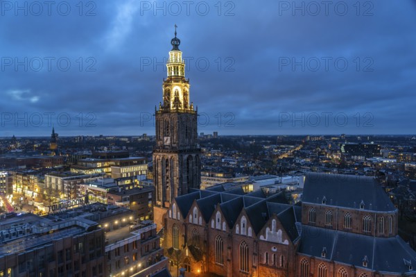 The church tower Martinitoren or Martinitower of the Martinikerk or Martinikirche seen from above at dusk, Groningen, Netherlands