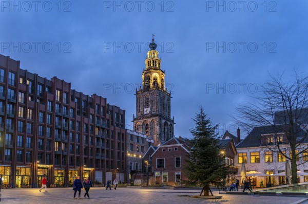 New Market and the Martinitoren church tower or Martinikerk church tower at dusk, Groningen, Netherlands