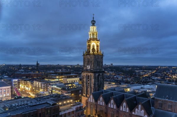 The church tower Martinitoren or Martinitower of the Martinikerk or Martinikirche seen from above at dusk, Groningen, Netherlands