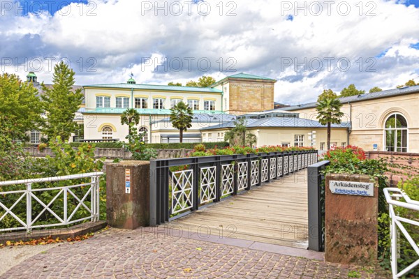 Promenade and arcade footbridge on the Franconian Saale in Bad Kissingen, Bavaria, Germany