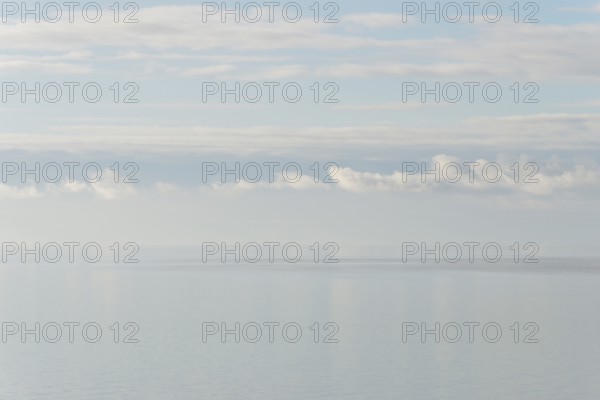 North Sea coast, special light atmosphere over the Wadden Sea with rising water and calm wind, Norddeich, Lower Saxony, Germany