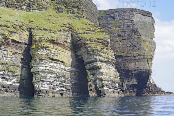 Dramatic cliffs with geological stratification over the sea, Isle of Noss, Shetland Islands, Scotland, Great Britain