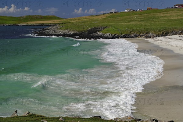 A picturesque beach with turquoise water and gentle waves under a blue sky, Scalloway, Shetland Islands, Atlantic Ocean, Scotland, United Kingdom