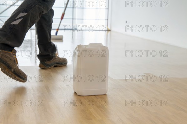 Professional sealing of a new parquet floor with lacquer