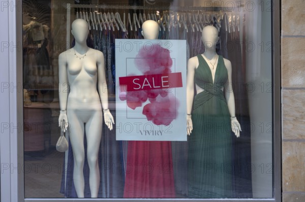 Nude and clothed mannequins in a fashion shop for sale, Bavaria, Germany