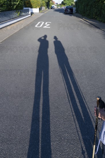 Silhouette of an old couple on a walk, Bavaria, Germany
