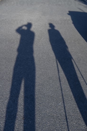 Silhouette of an old couple on a walk, Bavaria, Germany