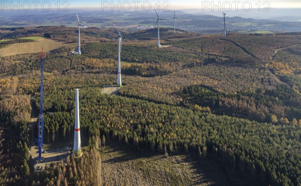 Aerial photo, wind turbines and construction site for a new wind turbine in the Riesenhagen forest area at Iserlohner Postweg and Eisenweg in Neuenrade, Sauerland, North Rhine-Westphalia, Germany, construction work, construction area, construction site, construction project, construction site, DE, Europe, aerial photo, aerial photography, aerial photography, new construction, Neuenrade, overview, bird's eye view, WEA, wind energy, wind turbine, wind power, wind turbine, wind farm, wind turbines, birds-eyes view, overview