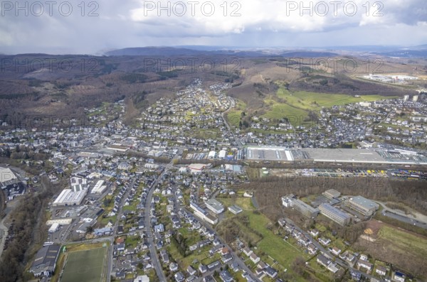 Downtown Kölner Straße, Salchendorf, Neunkirchen, Siegerland, North Rhine-Westphalia, Germany, authority, education, educational institution, DE, shopping markets, shopping centre, Europe, primary school, primary school Neunkirchen, property tax, hilly landscape, real estate, educational institute, aerial view, aerial photograph, aerial photography, aerial photography, local supply centre, town hall, Rewe supermarket, school, overview, bird's eye view, living and working, living and life, residential area, residential buildings, birds-eyes view, overview