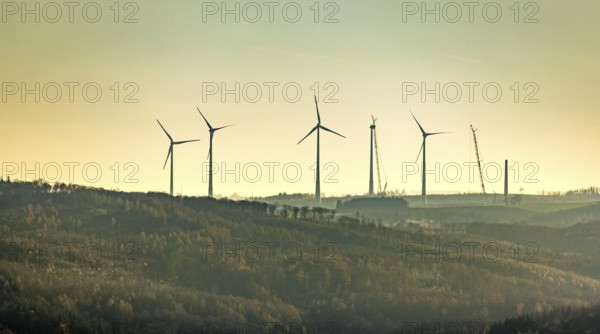 Aerial photo, wind turbines and construction site for a new wind turbine in the Riesenhagen forest area at Iserlohner Postweg and Eisenweg in Neuenrade, Sauerland, North Rhine-Westphalia, Germany, construction work, construction area, construction site, construction project, construction site, DE, Europe, aerial photo, aerial photography, aerial photography, new construction, Neuenrade, overview, bird's eye view, WEA, wind energy, wind turbine, wind power, wind turbine, wind farm, wind turbines, birds-eyes view, overview