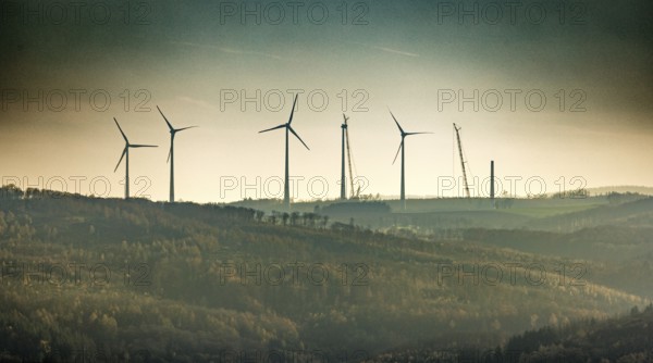 Aerial photo, wind turbines and construction site for a new wind turbine in the Riesenhagen forest area at Iserlohner Postweg and Eisenweg in Neuenrade, Sauerland, North Rhine-Westphalia, Germany, construction work, construction area, construction site, construction project, construction site, DE, Europe, aerial photo, aerial photography, aerial photography, new construction, Neuenrade, overview, bird's eye view, WEA, wind energy, wind turbine, wind power, wind turbine, wind farm, wind turbines, birds-eyes view, overview
