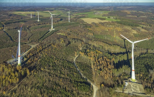 Aerial photo, wind turbines and construction site for a new wind turbine in the Riesenhagen forest area at Iserlohner Postweg and Eisenweg in Neuenrade, Sauerland, North Rhine-Westphalia, Germany, construction work, construction area, construction site, construction project, construction site, DE, Europe, aerial photo, aerial photography, aerial photography, new construction, Neuenrade, overview, bird's eye view, WEA, wind energy, wind turbine, wind power, wind turbine, wind farm, wind turbines, birds-eyes view, overview