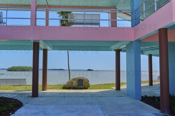 Pastel-coloured building with a view of the sea and a small island, National Park Info Center, Flamingo, Everglades National Park, Florida, USA