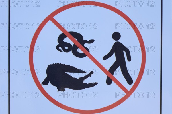 Prohibition sign with images of a snake, a crocodile and a person, Flamingo, Marina, Everglades National Park, Florida, USA